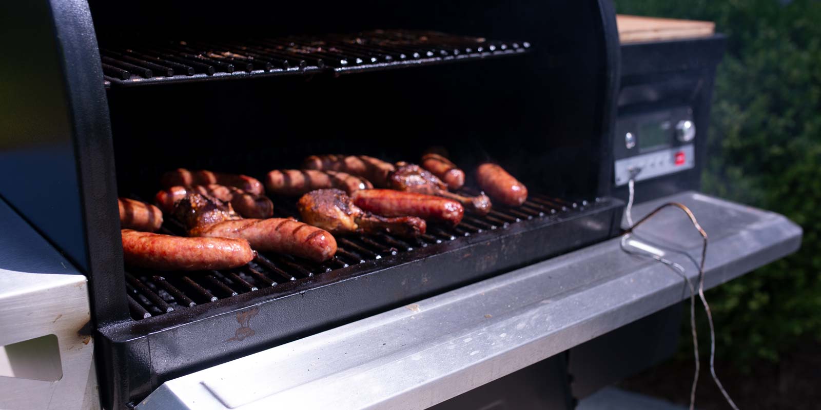 Hot dogs grilling on a traeger